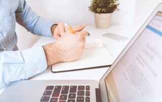 Man working on plan for outsourcing HR