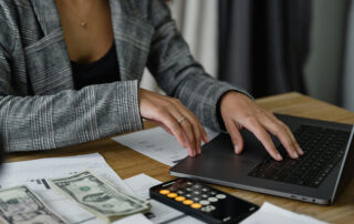 woman working on computer finances