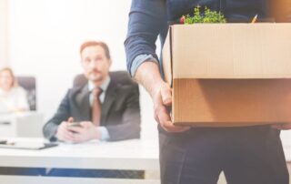 worker with box of belongings