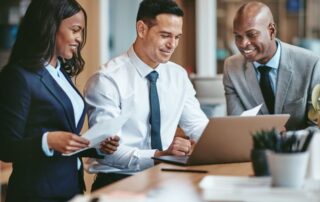 A diverse group of HR and business professionals reviewing documents.